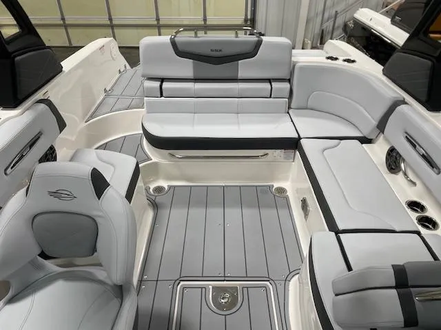 Slide: The Image of 2025 Chaparral 247 SSX boat interior with sleek gray seating and modern design. - 6