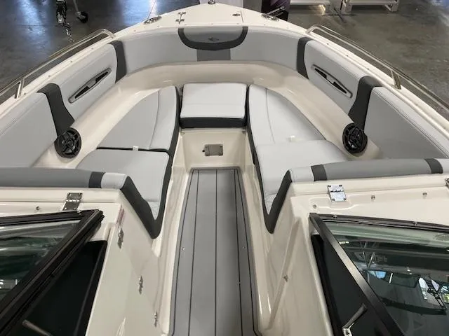 Slide: The Image of 2025 Chaparral 247 SSX boat interior with gray seating and modern design. - 7