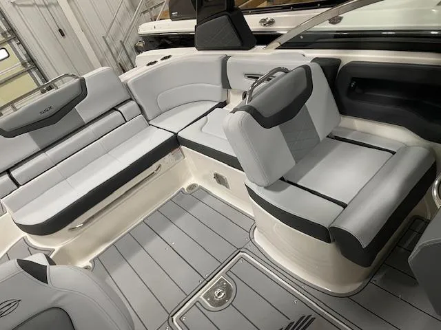 Slide: The Image of 2025 Chaparral 247 SSX boat interior with gray seating and flooring. - 8