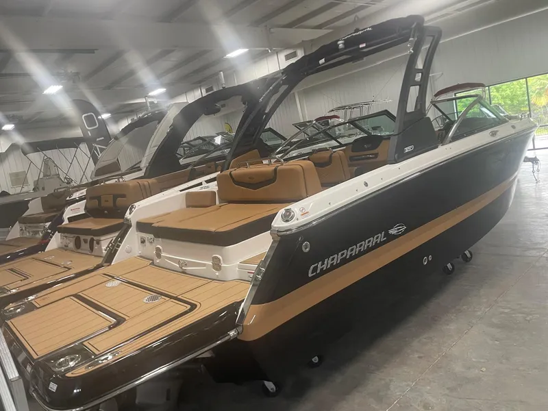 Slide: The Image of 2024 Chaparral 247 SSX boat in showroom, rear view. - 0