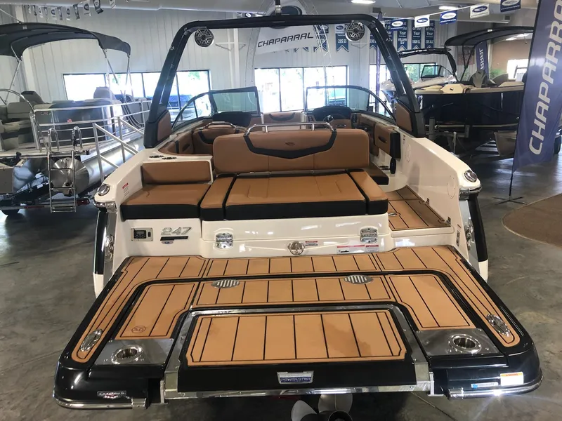 Slide: The Image of 2024 Chaparral 247 SSX boat interior with tan seating and swim platform. - 3