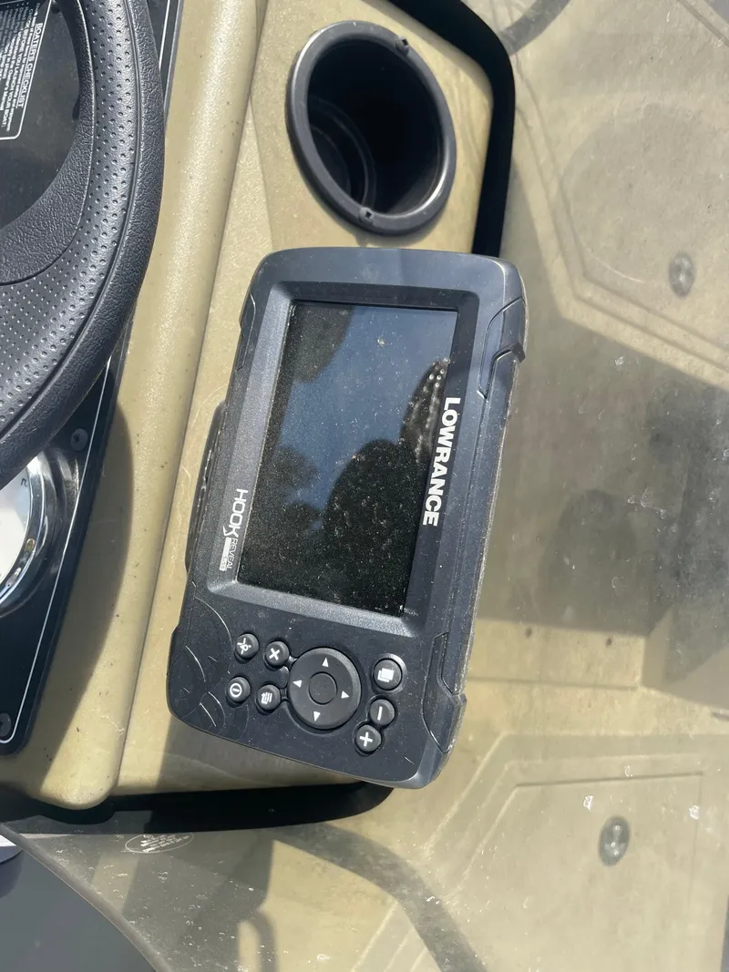 Slide: The Image of Lowrance fish finder on 2024 Tracker Grizzly 2072 CC Sportsman boat dashboard. - 11