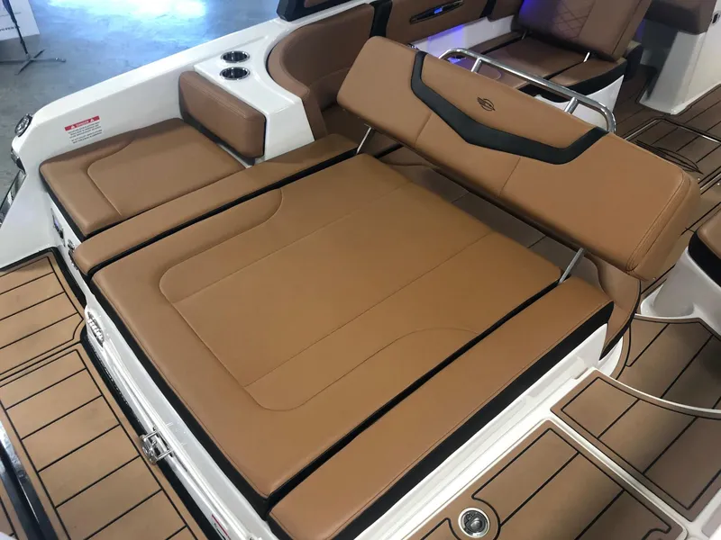 Slide: The Image of 2024 Chaparral 247 SSX boat with tan leather seating and modern design. - 18