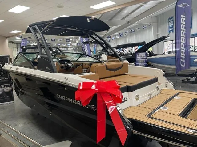 Slide: The Image of 2024 Chaparral 247 SSX boat with red bow in showroom. - 4