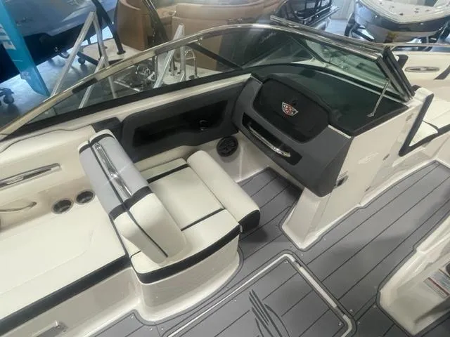 Slide: The Image of 2024 Chaparral 247 SSX boat interior with sleek seating and modern dashboard. - 11