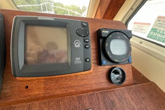 Slide: The Image of Control panel of 1989 Blue Seas Flybridge Cruiser with navigation instruments. - 16