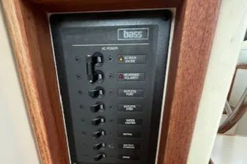 Slide: The Image of Control panel on 1989 Blue Seas Flybridge Cruiser with switches and indicators. - 19