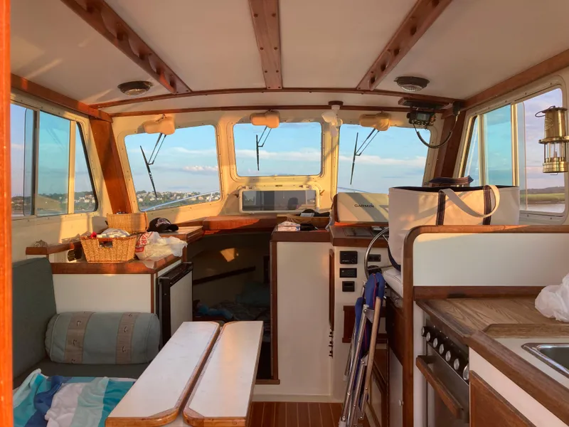 Slide: The Image of Interior of 1989 Blue Seas Flybridge Cruiser with wooden accents and nautical decor. - 3