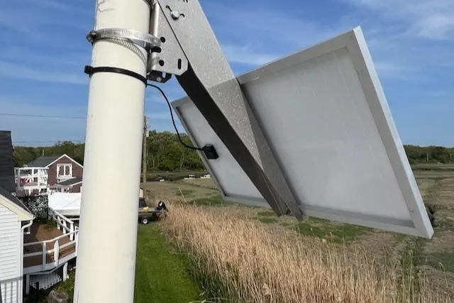 Slide: The Image of Solar panel mounted on a pole near a Blue Seas Flybridge Cruiser, 1989 model. - 30