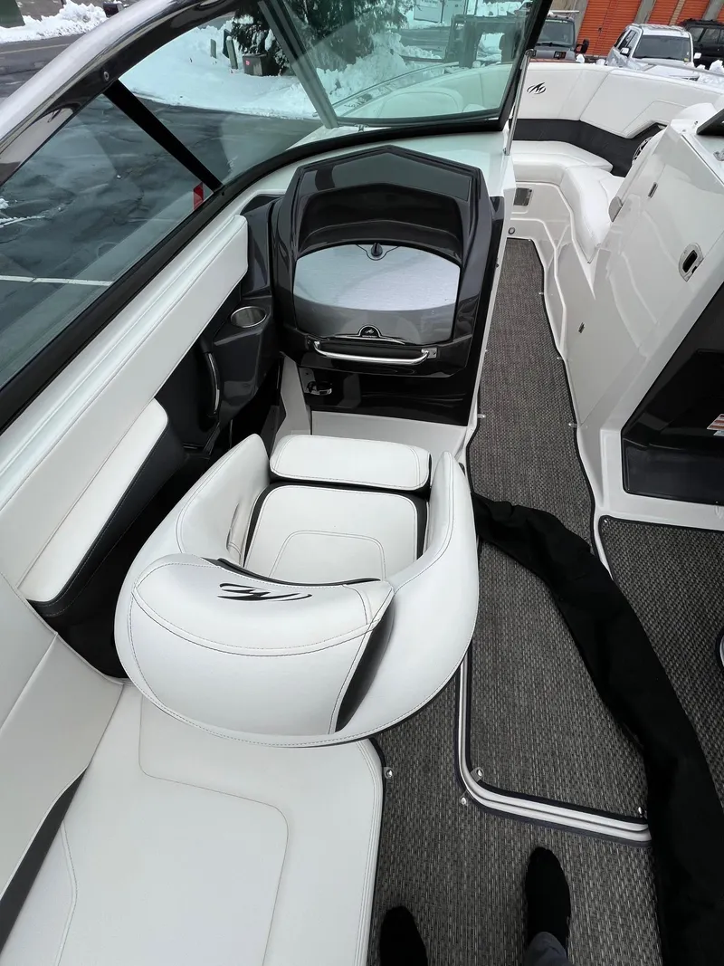 Slide: The Image of 2014 Monterey 268 boat interior with white seating and modern dashboard. - 11