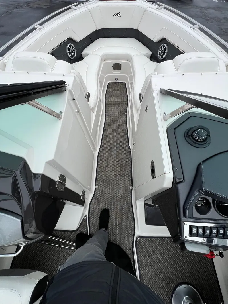 Slide: The Image of 2014 Monterey 268 boat interior with seating and control panel. - 12