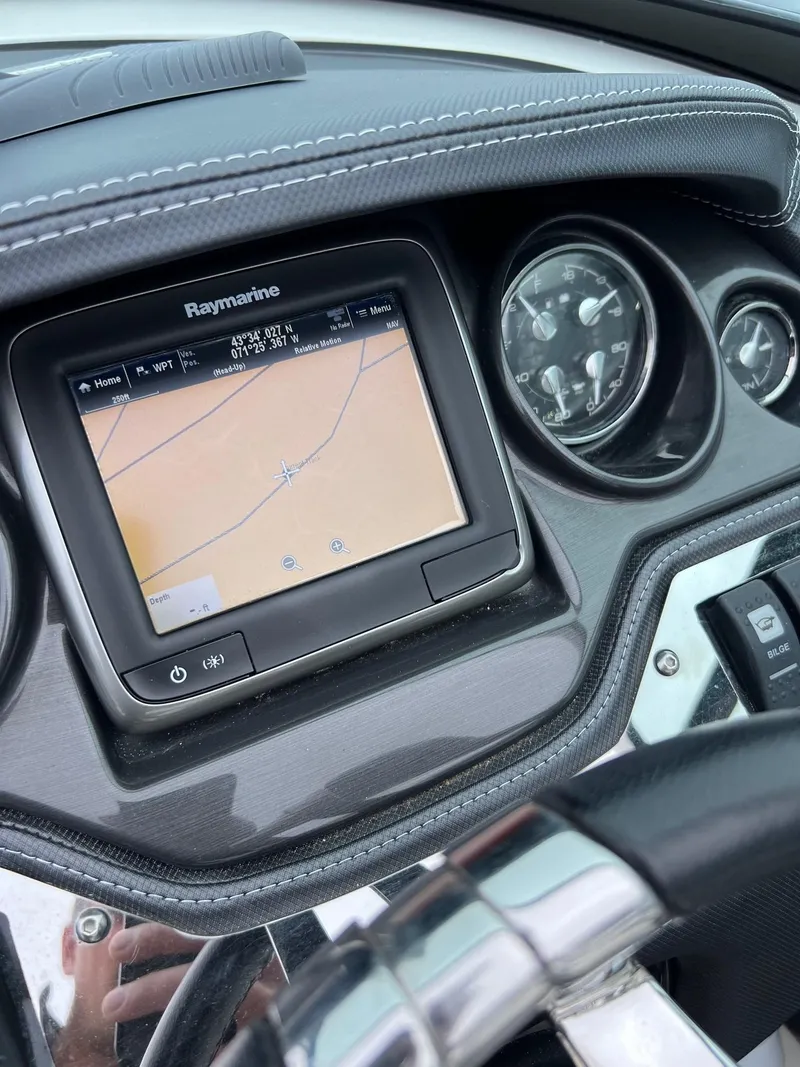 Slide: The Image of Dashboard of a 2014 Monterey 268 boat with Raymarine navigation system. - 15