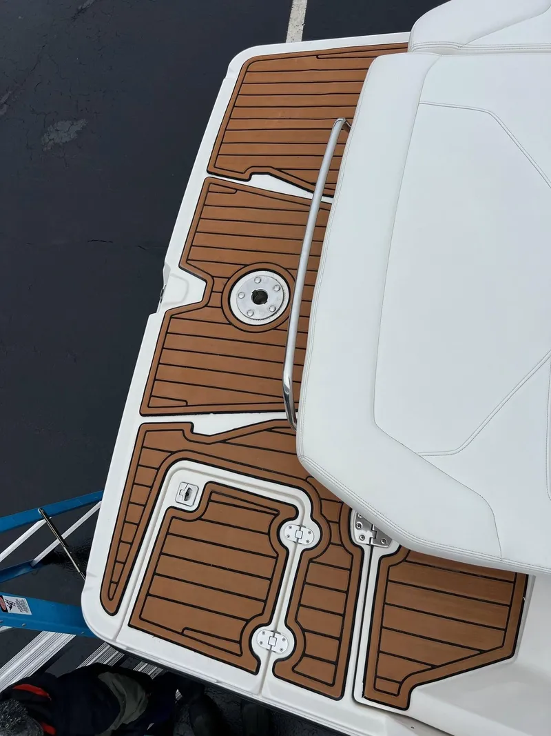 Slide: The Image of 2014 Monterey 268 boat with teak deck and white seating. - 7