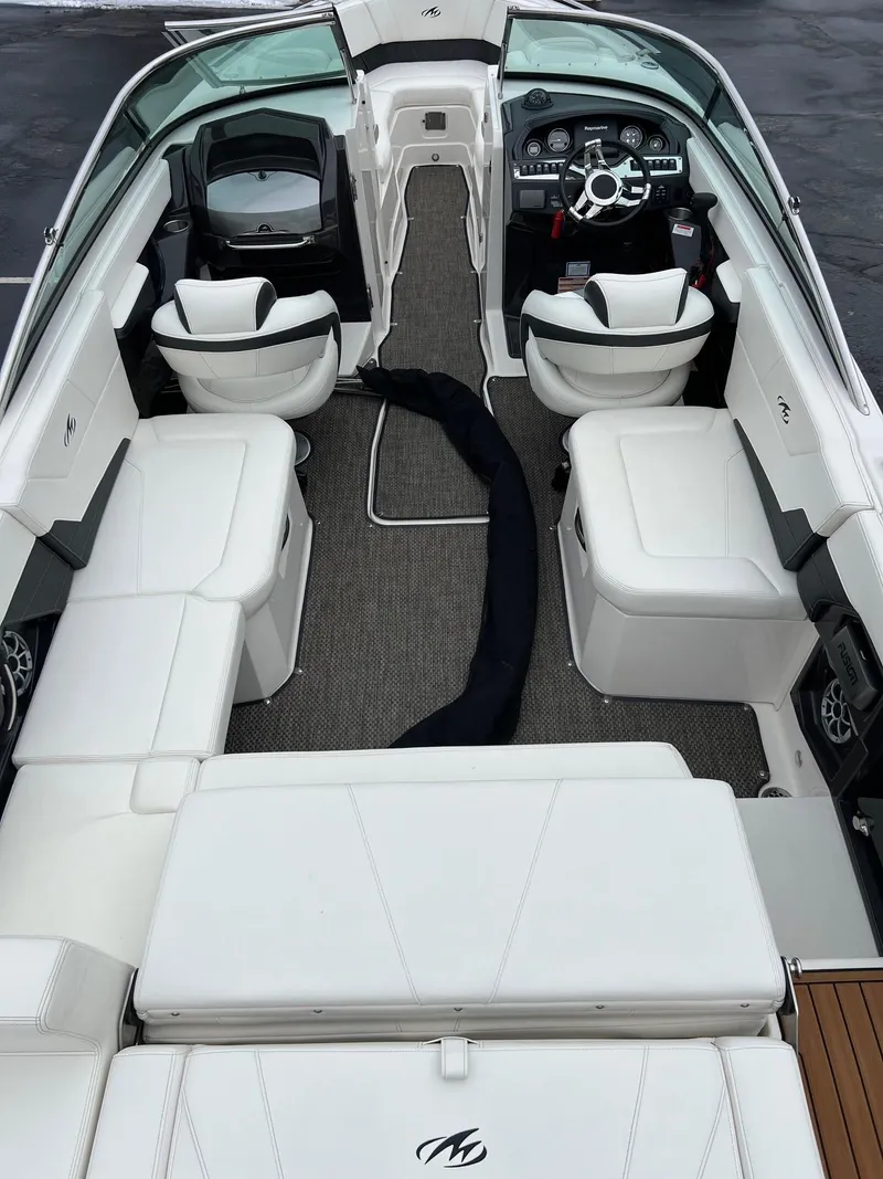 Slide: The Image of 2014 Monterey 268 boat interior with white seating and modern dashboard. - 8