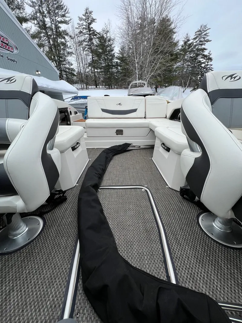 Slide: The Image of 2014 Monterey 268 boat interior with white and gray seating. - 9