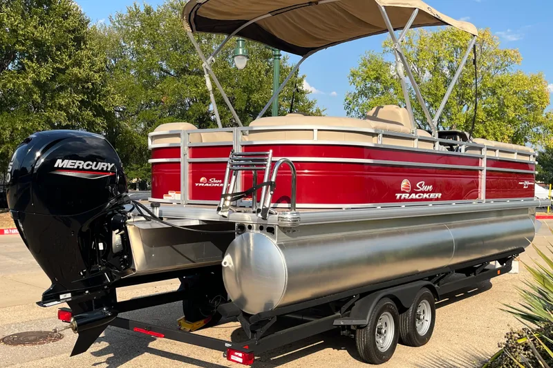 Slide: The Image of 2024 Sun Tracker Party Barge 24 DLX pontoon boat with Mercury engine on trailer. - 3