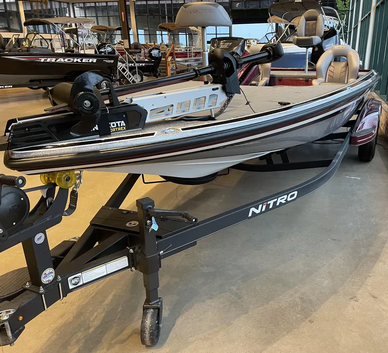Slide: The Image of 2024 Nitro Z21 XL boat on trailer in showroom setting. - 3