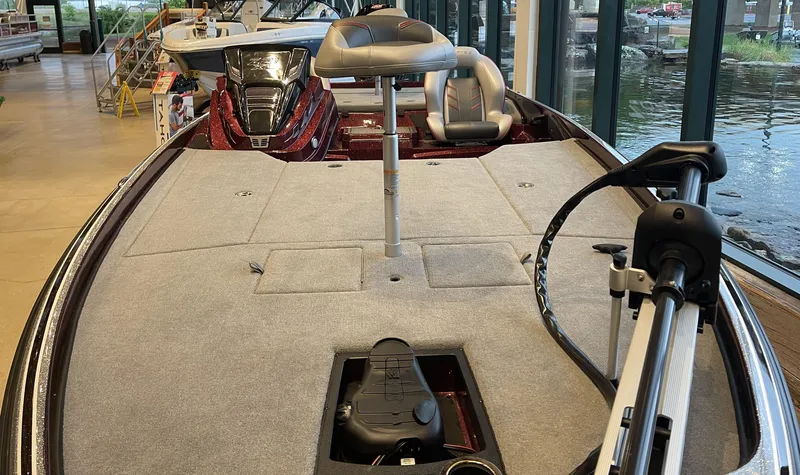 Slide: The Image of 2024 Nitro Z21 XL boat interior with fishing deck and seating, displayed indoors. - 5