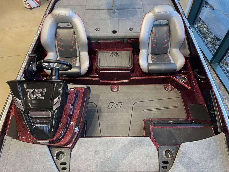 Slide: The Image of 2024 Nitro Z21 XL boat interior with dual seats and steering console. - 6