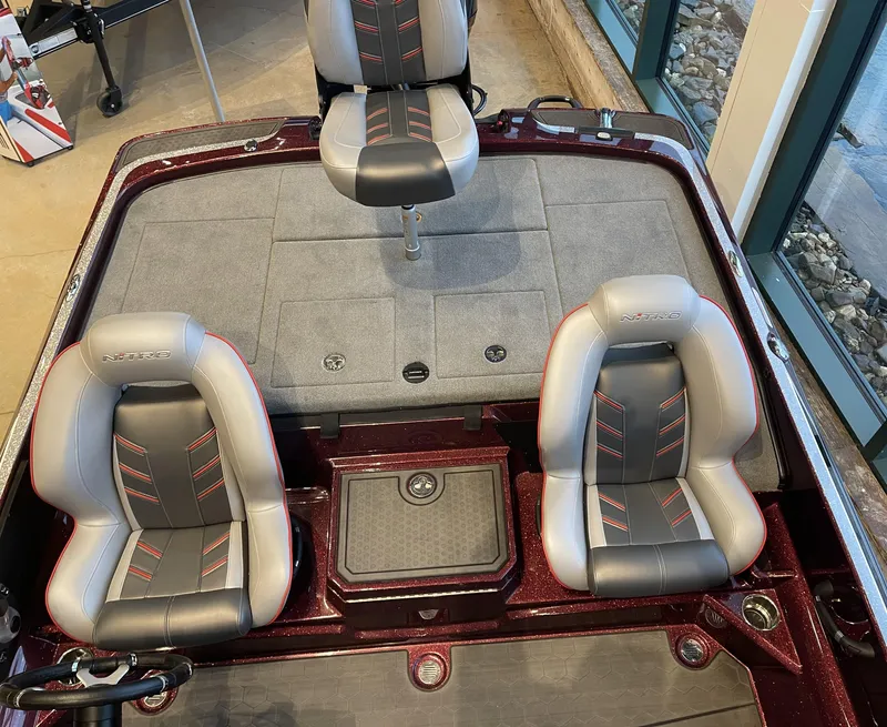 Slide: The Image of 2024 Nitro Z21 XL boat interior with three seats and storage compartments. - 7