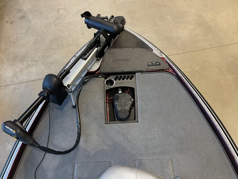 Slide: The Image of 2024 Nitro Z21 XL boat deck with trolling motor and control panel. - 8