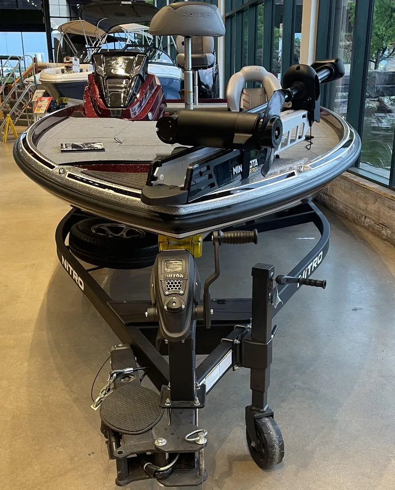 Slide: The Image of 2024 Nitro Z21 XL boat on display in showroom, front view. - 9