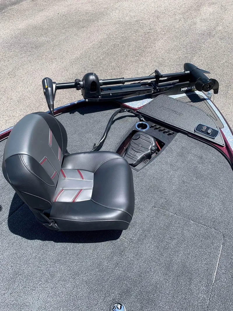 Slide: The Image of 2024 Nitro Z18 boat interior with fishing seat and trolling motor. - 7