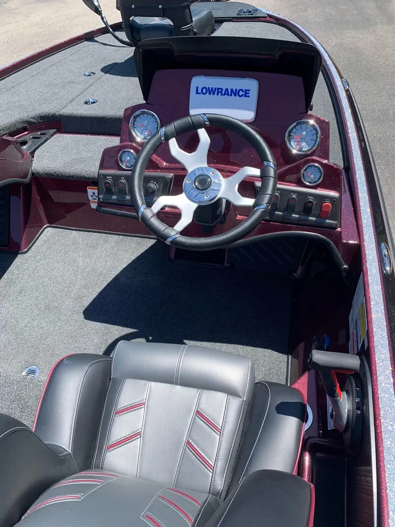 Slide: The Image of 2024 Nitro Z18 boat dashboard with Lowrance electronics and steering wheel. - 9