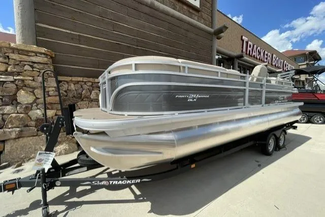 The Image of 2024 Sun Tracker Party Barge 24 DLX pontoon boat on trailer at Tracker Boat Center. - 0