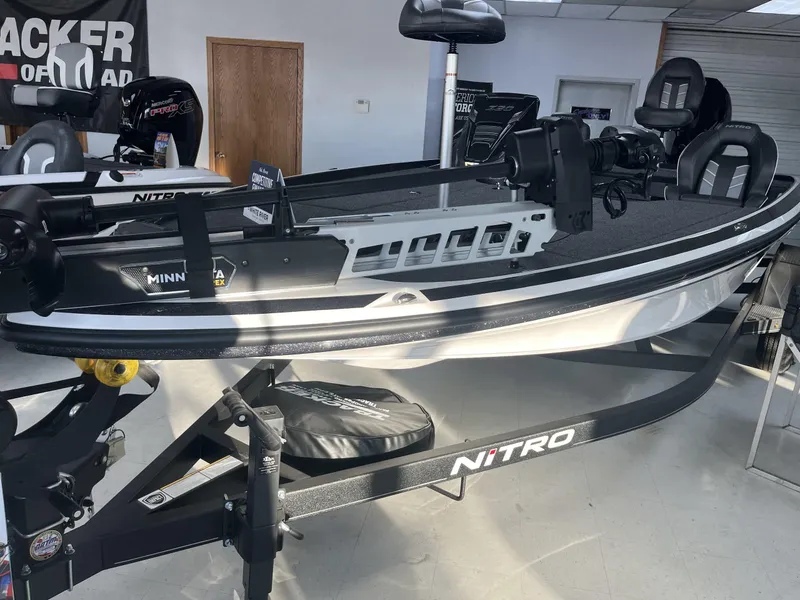 Slide: The Image of 2024 Nitro Z20 fishing boat in showroom, featuring Minn Kota trolling motor. - 3