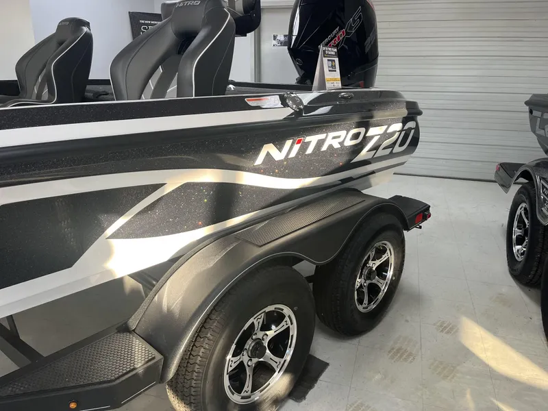 Slide: The Image of 2024 Nitro Z20 boat on trailer, featuring sleek design and dual seats. - 5