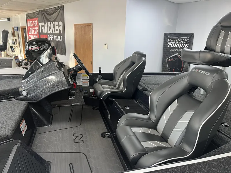 Slide: The Image of 2024 Nitro Z20 boat interior with sleek black and gray seating. - 6