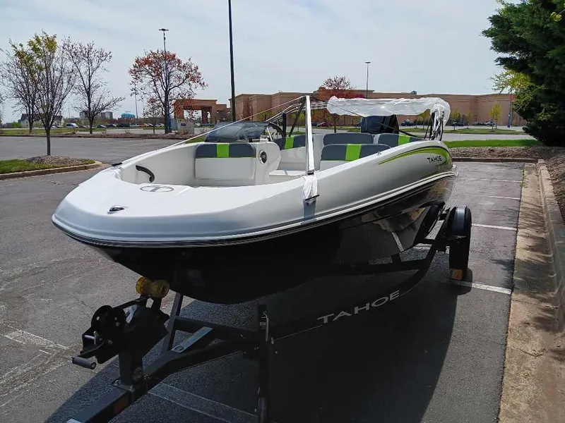 Slide: The Image of 2024 Tahoe T16 boat on trailer in parking lot. - 1