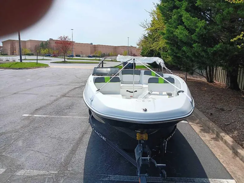 Slide: The Image of 2024 Tahoe T16 boat parked in a lot, ready for transport. - 4