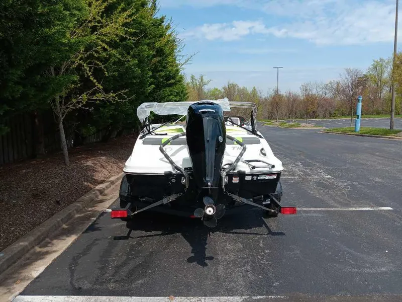 Slide: The Image of 2024 Tahoe T16 boat on trailer in parking lot, rear view. - 5