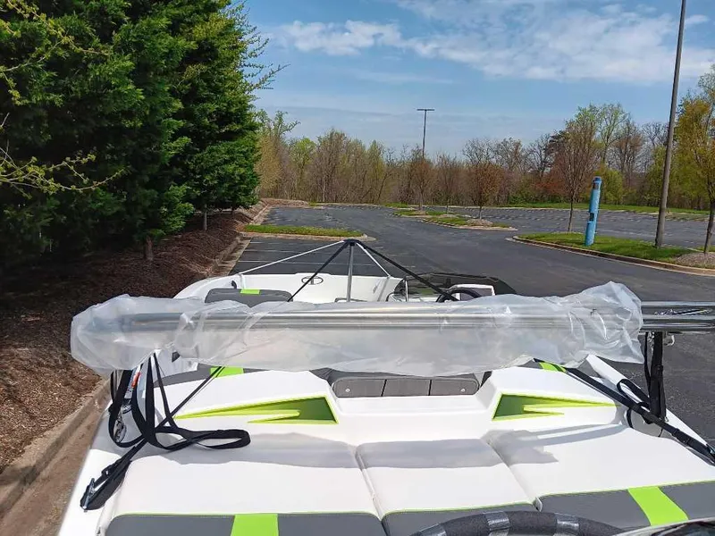 Slide: The Image of 2024 Tahoe T16 boat parked outdoors, featuring sleek design and vibrant accents. - 9