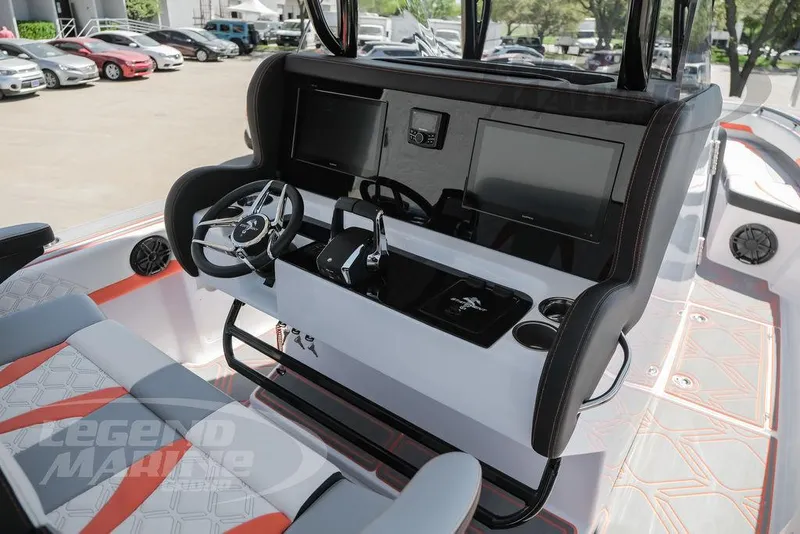 Slide: The Image of 2025 Statement 350 Open boat dashboard with dual screens and modern controls. - 10