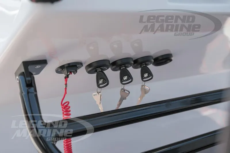 Slide: The Image of 2025 Statement 350 Open boat ignition keys and switches, Legend Marine Group branding. - 16