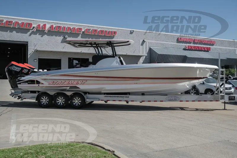 Slide: The Image of 2025 Statement 350 Open boat on a trailer outside Legend Marine Group showroom. - 3