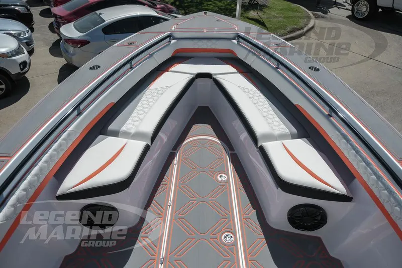 Slide: The Image of 2025 Statement 350 Open boat interior with white and orange seating, Legend Marine Group. - 33