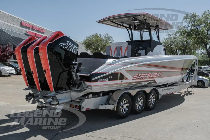 Slide: The Image of 2025 Statement 350 Open boat with triple outboard engines on a trailer. - 4