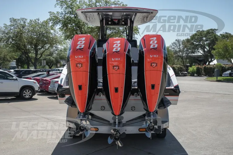 Slide: The Image of 2025 Statement 350 Open boat with triple 400R V10 engines in a parking lot. - 5