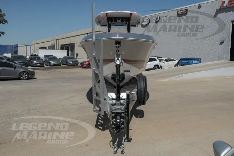 Slide: The Image of 2025 Statement 350 Open boat on trailer at Legend Marine Group dealership. - 8