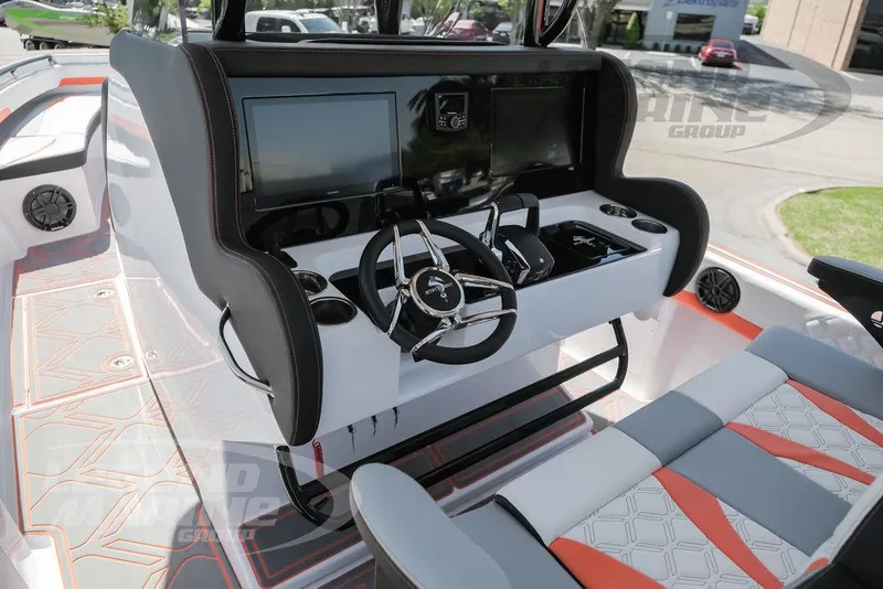 Slide: The Image of 2025 Statement 350 Open boat cockpit with modern steering wheel and dual screens. - 9