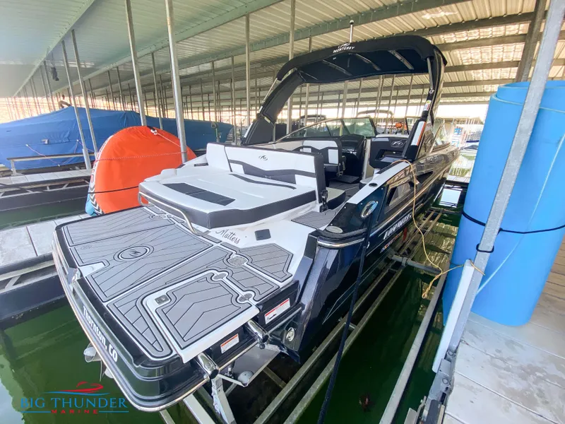 Slide: The Image of 2021 Monterey 278SS boat docked in a covered marina. - 12