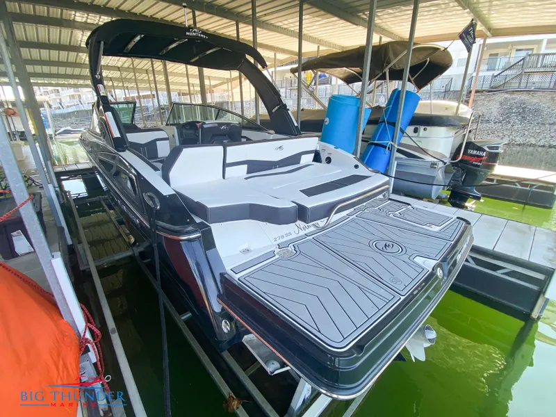 Slide: The Image of 2021 Monterey 278SS boat docked in a marina. - 13