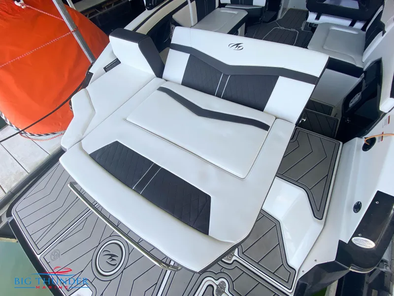 Slide: The Image of 2021 Monterey 278SS boat with white and black seating and deck. - 16
