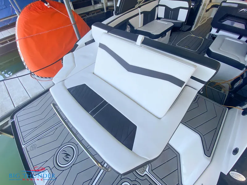 Slide: The Image of 2021 Monterey 278SS boat with white and black seating and deck. - 18