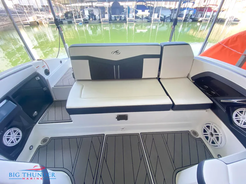 Slide: The Image of 2021 Monterey 278SS boat interior with cushioned seating and Big Thunder Marine logo. - 19