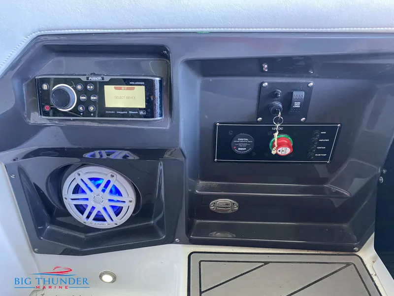 Slide: The Image of 2021 Monterey 278SS boat dashboard with stereo, speaker, and ignition controls. - 21